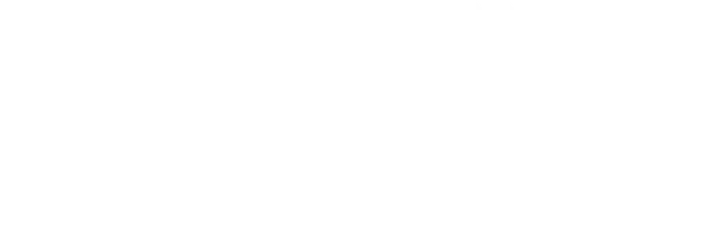 White porcelain teapot with a curved spout and handle.