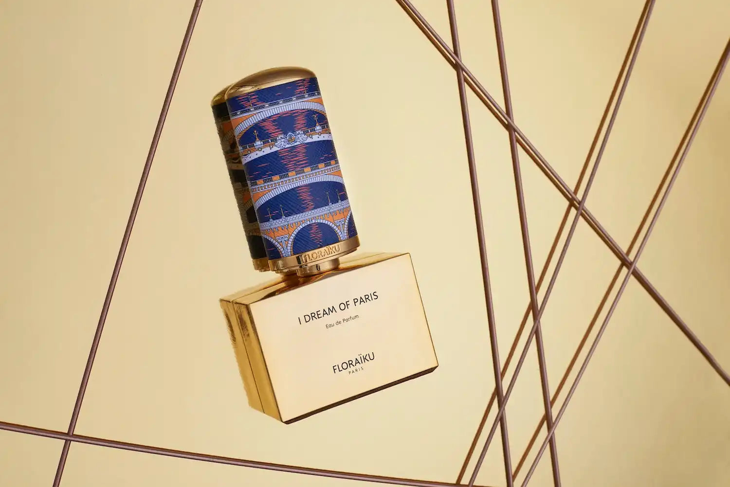 Perfume bottle with a decorative blue and purple striped cap.